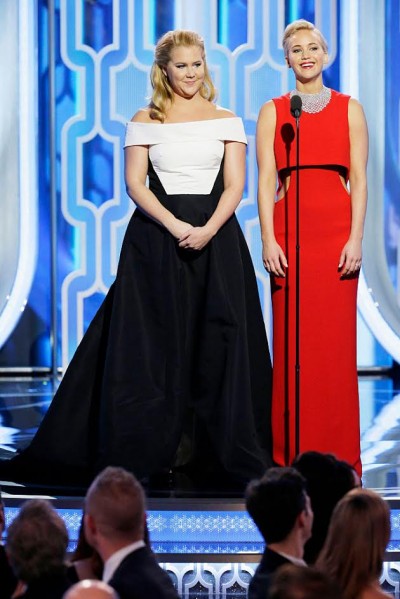 BEVERLY HILLS, CA - JANUARY 10: In this handout photo provided by NBCUniversal,  Presenters Amy Schumer and Jennifer Lawrence speak onstage during the 73rd Annual Golden Globe Awards at The Beverly Hilton Hotel on January 10, 2016 in Beverly Hills, California.  (Photo by Paul Drinkwater/NBCUniversal via Getty Images)