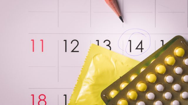 Birth control pills on calendar