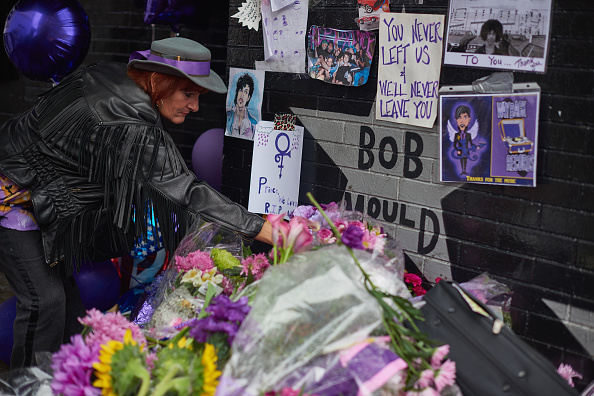 MINNEAPOLIS, MN - APRIL 24:  Prince fans gather at the memorial outside First Avenue nightclub, featured in Prince's 1984 movie Purple Rain on April 24, 2016 in Minneapolis, Minnesota. Prince died on April 21 at his Paisley Park compound at the age of 57.  (Photo by Jules Ameel/Getty Images)