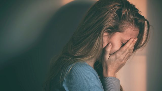 Woman sitting alone and depressed