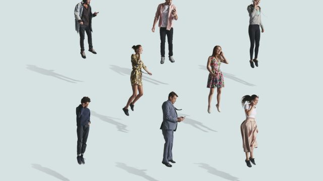 Group of people using phone while jumping