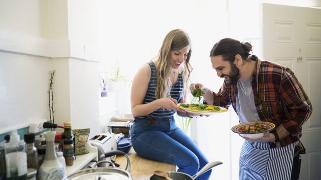 Couple cooking in kitchen