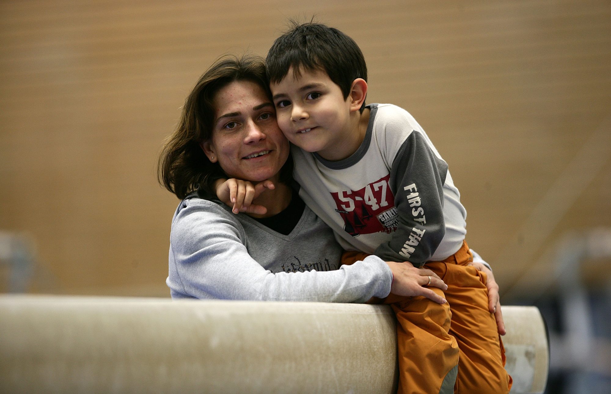 COLOGNE, GERMANY - DECEMBER 04:  German gymnast Oksana Chusovitina pose for a photo with her son Alisher prior to the training on December 04, 2006 in Cologne, Germany.  (Photo by Vladimir Rys/Bongarts/Getty Images)
