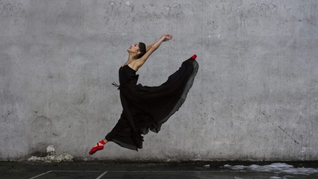 Ballerina performing Sissone outside