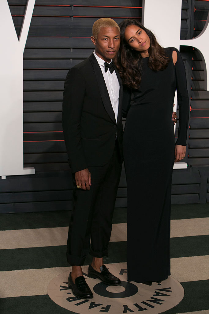 Pharrell Williams and Helen Lasichanh arriving to the Chanel show