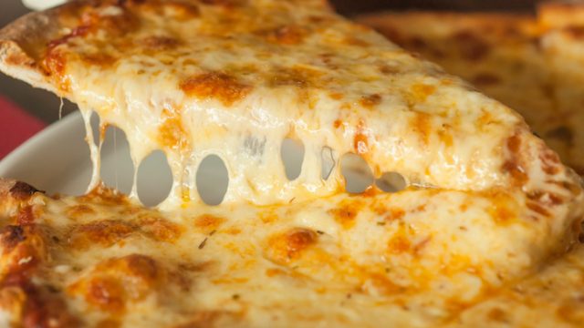 Slice of pizza margarita lifted up