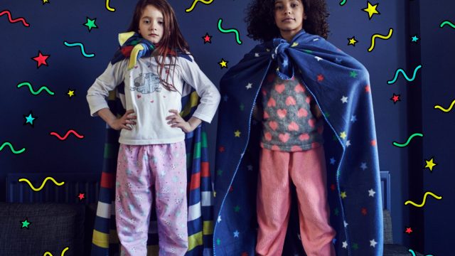 Girls dressed as Superheroes with graphic symbols