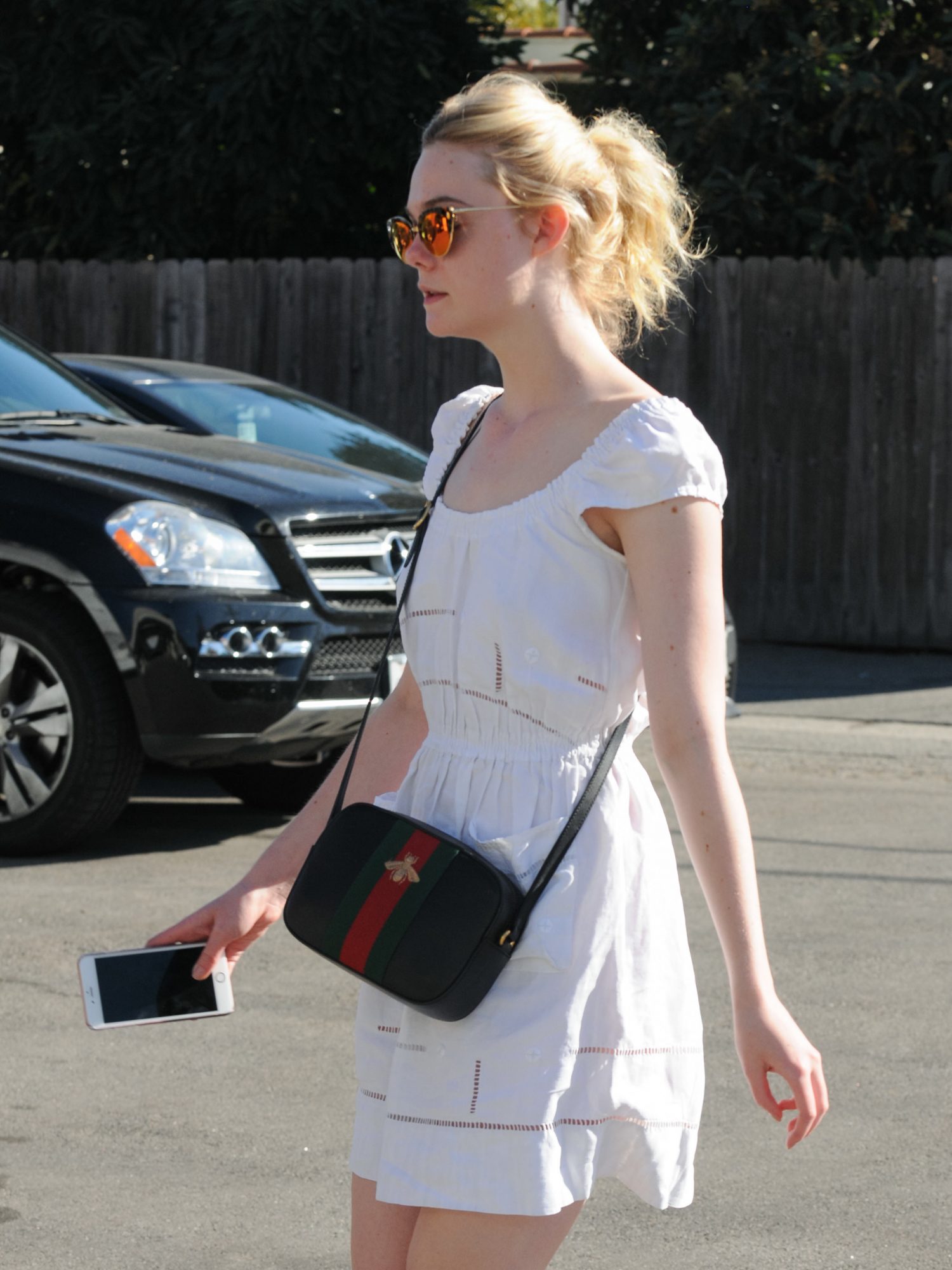 Elle Fanning's white dress looks both casual and comfy, we want to run errands it now - HelloGigglesHelloGiggles