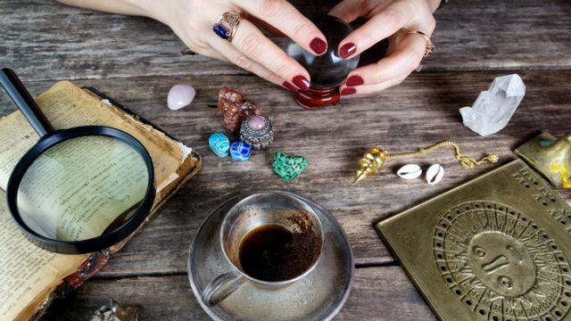 Fortune teller woman predicting future from cards