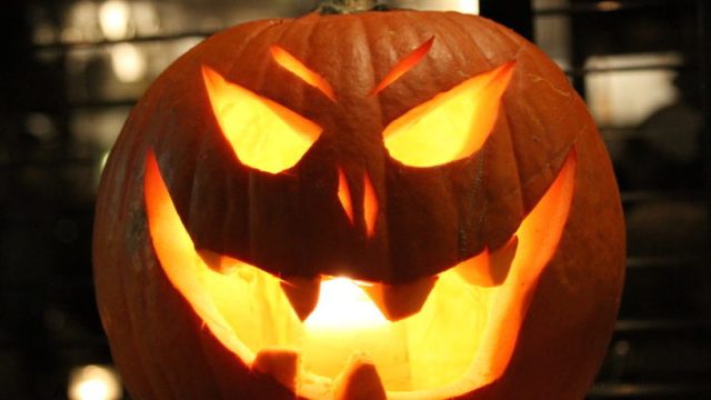 Illuminated Jack-O-Lantern On Table