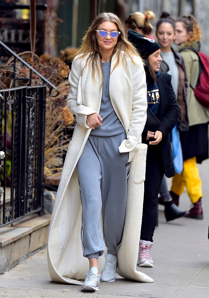 Gigi Hadid s crazy long coat sweatpants lewk is our new fall uniform HelloGigglesHelloGiggles