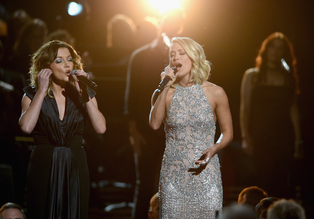 NASHVILLE, TN - NOVEMBER 02:  Martina McBride and Carrie Underwood perform for Dolly Parton onstage at the 50th annual CMA Awards at the Bridgestone Arena on November 2, 2016 in Nashville, Tennessee.  (Photo by Erika Goldring/FilmMagic)