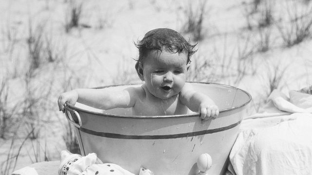 Baby sitting in tub