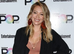 Hilary Duff's mustard yellow dress and knee-high boots make her
