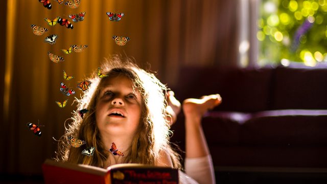 magical butterflies flying out of book fantasy