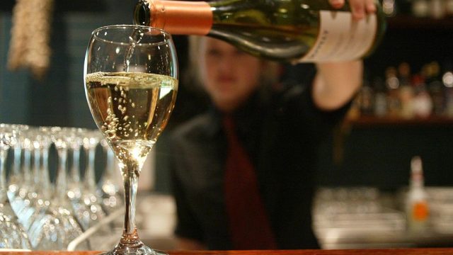 Carly Haynes pouring Seppelt Victorian Chardonnay at Sicilian restaurant in Parr