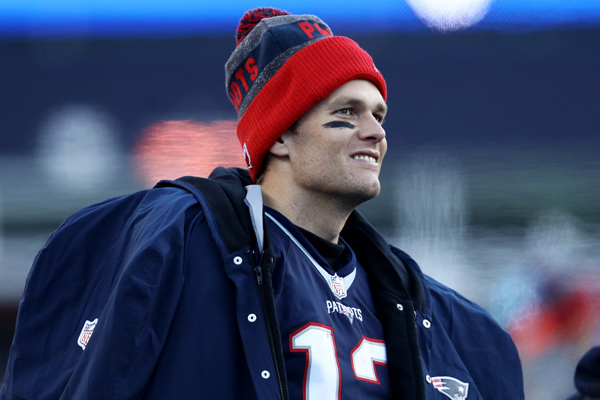 Day after win 201, Tom Brady poses with Brady family's Christmas tree