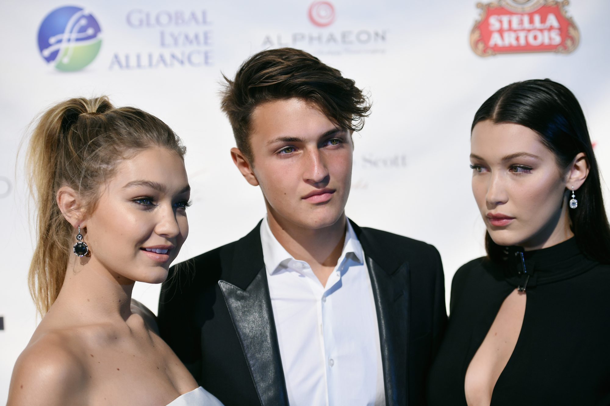 Like Sisters, Like Brother: Check in on Anwar Hadid's Small but Rapidly  Developing Bag Collection - PurseBlog