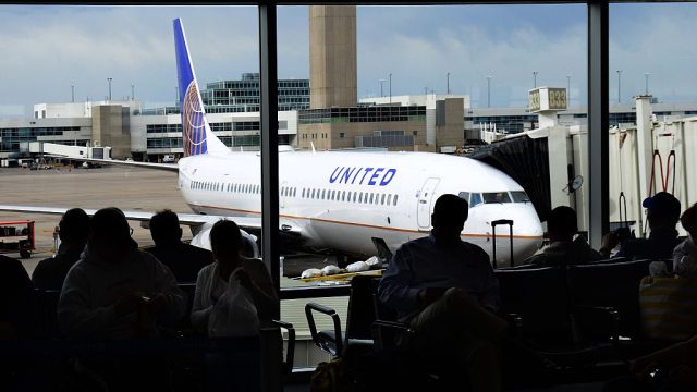 united airlines passengers wait in denver international airport