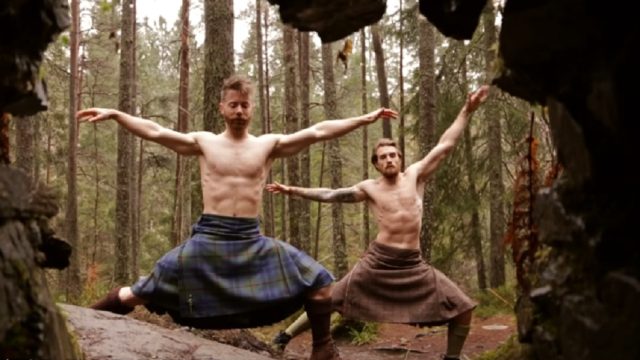 men doing yoga in kilts