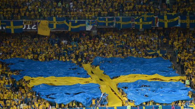 Fans form a Swedish flag before the Euro
