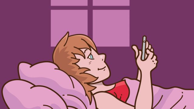 woman in bed using phone