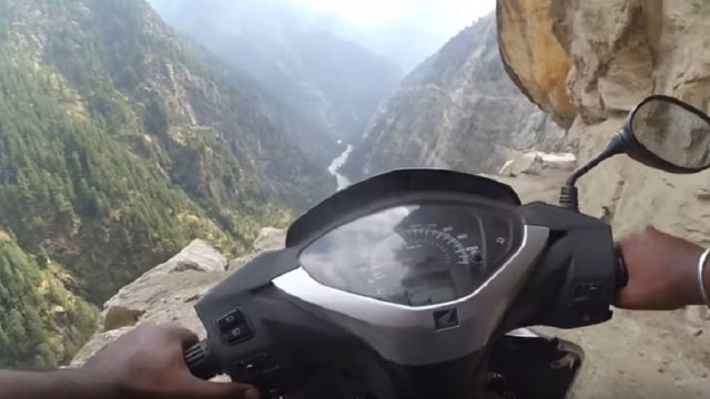 dangerous scooter ride on mountainside