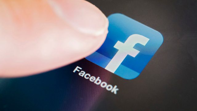 Detail of Facebook social media app icon on iPad tablet computer screen