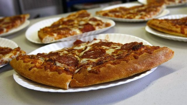 pizza slices on paper plates