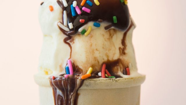 Studio shot of ice cream cone with chocolate sauce