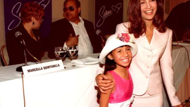 Becky Lee Meza (L), 9, and Jennifer Lopez (R) stan