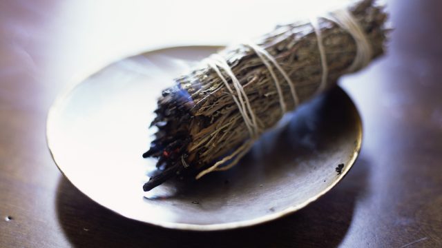 Burning sage bundle purifies