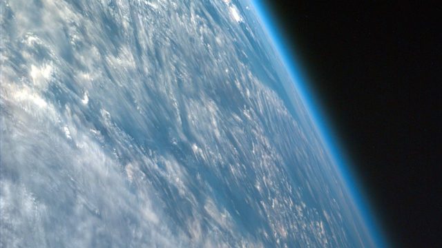 Image shot over northwestern part of the African continent captures the curvature of the Earth and shows its atmosphere. taken from the Space Shuttle