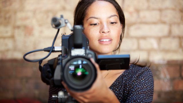 woman behind camera
