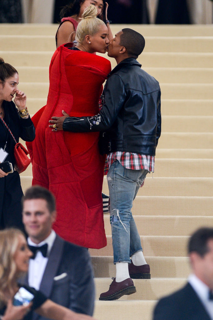 Essence - One of fashion's favorite couples, Pharrell Williams and wife,  Helen Lasichanh, attend the Yellow Ball in a pair of dapper suits