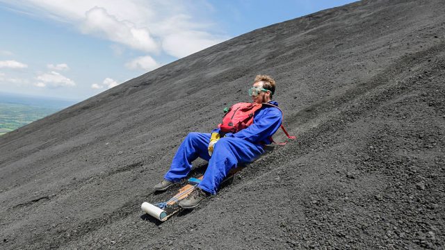 guy sandboards down cerro negro volcano in nicaragua