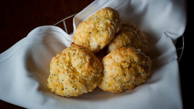 A basket of cheddar bay biscuits