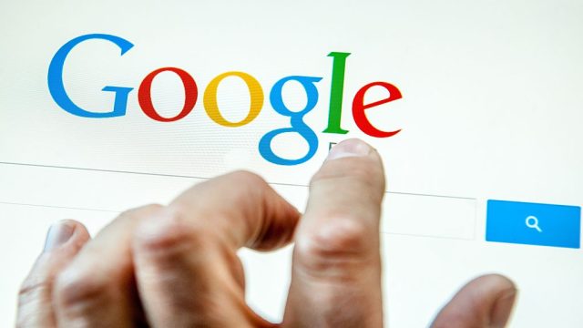 Google search bar with typing hand