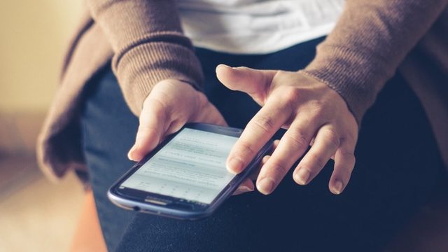 Woman looking at her cell phone