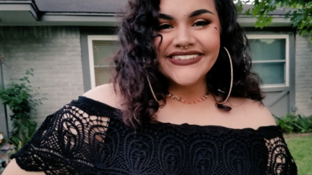 Mexican-American Charlie Peña smiles in their swap meet prom dress