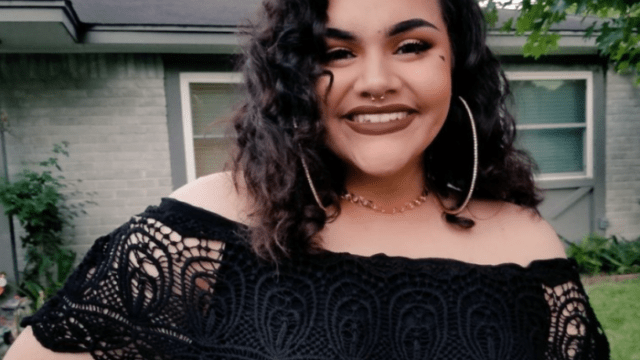 Mexican-American Charlie Peña smiles in their swap meet prom dress