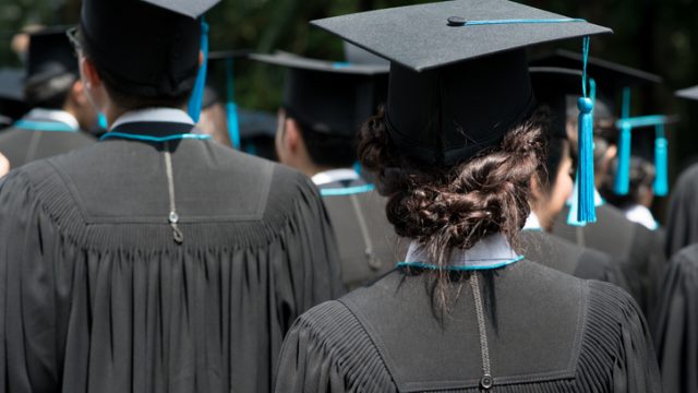 Graduates in cap and gown