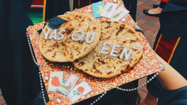Two pupusas on a graduation cap with "YAS QUEEN" on it