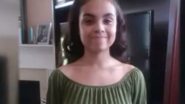 Summer, student wearing a shirt that shows her shoulders