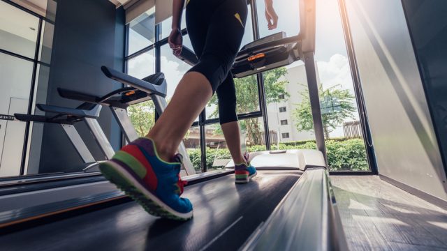 Picture of a woman running on a treadmill.