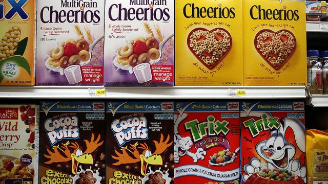 boxes of General Mills cereal on store shelves