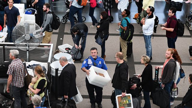 Travelers, at Denver International Airport, make there way through security lines as people start traveling for the long Memorial Day weekend, May 26, 2016. Officials at Denver International Airport are planing to see over million travelers during the Memorial Day weekend. Cutbacks in the Transportation Security Administration have caused thousands of travelers to miss their flights across the country.