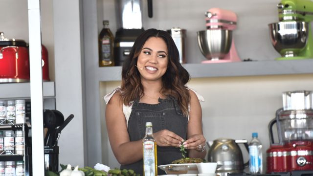 Ayesha Curry participates in a cooking demo.