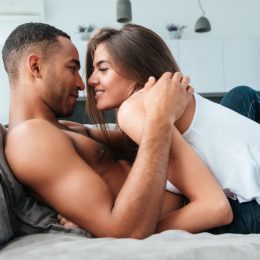 Couple cuddling on a couch