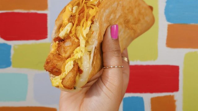 Hand holding a taco